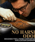 Person applying Top Shelf Microcrystalline Wax Polish Kit With Gotto Formula For Wood Leather Metal Stone Furniture And Varnish Including Handy Applicator And Cotton Buffing Rag on carved wooden furniture.