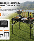 Folding Grill Table With Mesh Desktop for Camping and Outdoor Use, featuring adjustable height and compact tabletop with cooking items.