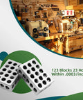 Front-angled view of two 1x2x3 tool-steel precision blocks with 23 holes
