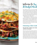 Budget Slow Cooker And Instant Pot Cookbook 127 Quick Easy Affordable Recipes showcasing layered beef and bean dish on blue plate.