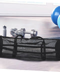 Large Mesh Sports Gear Bag For Gym And Outdoors with fitness equipment in a bright workout room