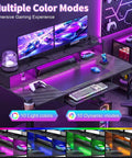 Image of an electric standing desk showcasing customizable RGB lighting, dual monitors, and gaming accessories, 48x24 inches.