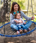 Girl and toddler sitting on Heavy Duty 45 Inch Spider Web Tree Swing For Kids And Adults Outdoor Steel Frame Saucer Net Swing