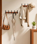Solid Wood Wall Mounted Coat Rack With Five Heavy Duty Metal Hooks Holds Up To 25 Lbs Each in a stylish entryway setting.