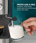 Compact Espresso Machine With 15 Bar Pump And Steam Wand Milk Frother Automatic Coffee Maker frothing milk for cappuccinos.