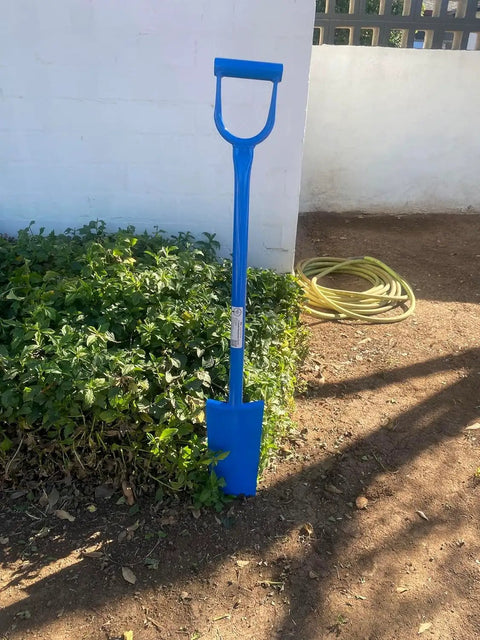 Heavy Duty All Steel Sharpshooter Shovel With Long Handle And Hardened Heat Sharpened Chromoly 15 Inch Head resting on soil.
