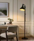 Industrial Floor Lamp With 180 Degree Adjustable Head, Lit LED Reading Light For Living Room Office And Bedroom, Cozy Farmhouse Style Standing Lamp For Stunning Home Decor, placed beside a desk in a modern room setting, emitting a warm light.