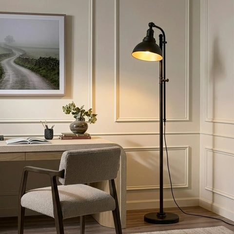 Industrial Floor Lamp With 180 Degree Adjustable Head, Lit LED Reading Light For Living Room Office And Bedroom, Cozy Farmhouse Style Standing Lamp For Stunning Home Decor, placed beside a desk in a modern room setting, emitting a warm light.