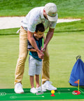Child and adult using Toddler Golf Set With Retractable Clubs And Putting Mat Kid Friendly Indoor Outdoor Practice Kit with bag