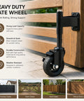 Heavy Duty Workhorse 4 Inch Galvanized Steel Gate Wheels With Locking Foot Brake Black 2 Pack Rust Resistant outdoor caster mounted on gate.