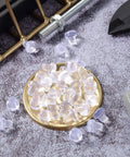 50 Pack Glass Table Top Bumpers With Stem Clear Rubber Grippers Soft PVC Anti Slip Pads on a decorative plate