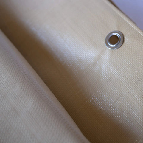 Close-up of Heavy Duty Waterproof Tarp 20 Ft By 30 Ft 12 Mil Thick Tan Tarp with reinforced corner and rope hem.