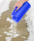 Person using All Season Handheld Spreader For Salt, Seed And Fertilizer, Deicer And Ice Melt Ready, Portable Durable Plastic Spreader For Lawn