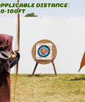 Archer aiming at target in front of 5x5 Ft Archery Backstop Netting Arrow Catcher For Bow Training outdoors