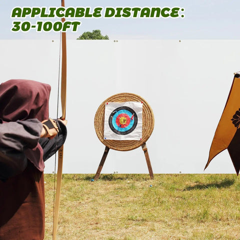 Archer aiming at target in front of 5x5 Ft Archery Backstop Netting Arrow Catcher For Bow Training outdoors