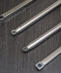 Four carbide woodturning tools with 12-inch bars and 17-inch stainless steel handles, top-down view