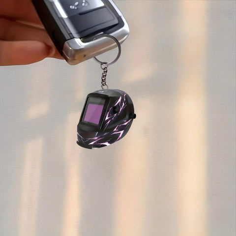 Lightning Pattern Welding Helmet Keychain With Durable Chain And Key Ring For Keys, Bags, And Cars held by a hand