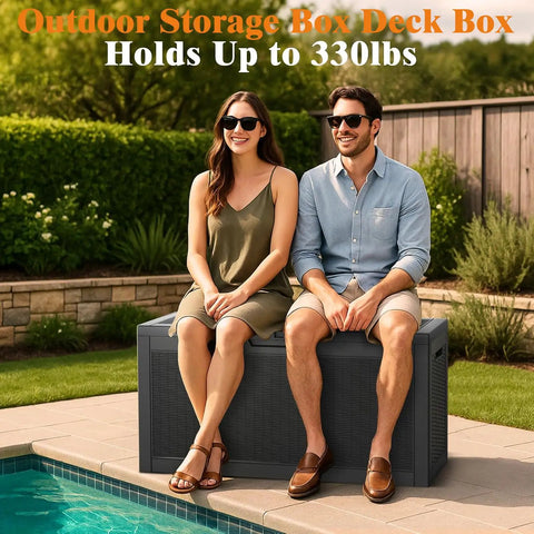 Two people sitting on a 66 Gallon All Weather Outdoor Storage Box With Locking Lid For Deck Patio And Garden Built Tough