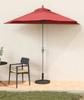 Red umbrella with Rock Solid Heavy Duty Half Round Patio Umbrella Base Weight, 33 Lb Resin Concrete Stand for stability, patio view.
