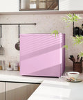 Slick 1.1 Cu Ft Compact Countertop Upright Freezer Featuring Smooth Temperature Dial And Handy Removable Shelf In Vibrant Pink on kitchen countertop.