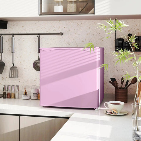 Slick 1.1 Cu Ft Compact Countertop Upright Freezer Featuring Smooth Temperature Dial And Handy Removable Shelf In Vibrant Pink on kitchen countertop.