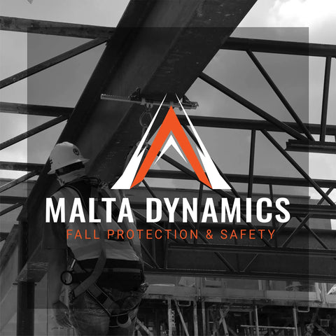 Construction worker wearing full brim hard hat with 4 point ratchet for safety on scaffolding, showing Malta Dynamics logo.