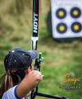 Archer aiming at target using Field And Competition Hip Arrow Quiver With 3 Slot System Holds 12 Plus Arrows Noise Free Design