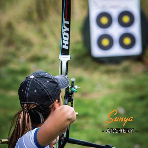 Archer aiming at target using Field And Competition Hip Arrow Quiver With 3 Slot System Holds 12 Plus Arrows Noise Free Design