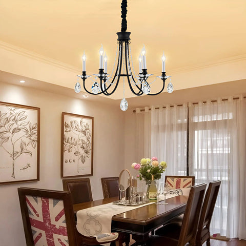 6 Light Black Crystal Chandelier With Chic Farmhouse Rustic Black Metal Frame And Adjustable Chain in a dining room.