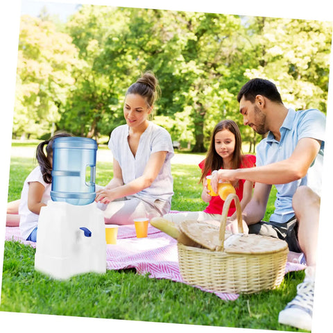 Family enjoying picnic with Go-To Compact Cold Water Dispenser For Countertop And Office Use on grass, emphasizing space saving