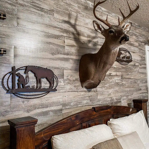 Vibe Ready Vinyl Wall Panels With Vintage Farmhouse Wood Pattern in bedroom, featuring deer mount and rustic decor.