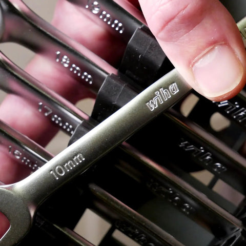 Close-up of 12 Piece Metric Wrench Set For Pro Mechanics with 10mm wrench, Chrome Vanadium design, comfort grip handles visible.