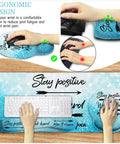 Stay Positive XXL Desk Mat Pad Set With Cushioned Wrist Rest For Mouse And Keyboard Large Gaming Mouse Pad With Wrist Support Extended Desk Pad For Your Home Office Setup Coaster Included Non Slip Ergonomic Workspace Vibes showing ergonomic design with wrist rest and hand placement.