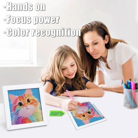 Mother and daughter creating Diamond Art Kit For Kids Ages 8 To 12 6x6 Canvas With 7x7 Frame, colorful cat design on table