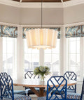 Dining room with blue chairs and round table beneath Boho Wood Beaded Pendant Chandelier 4 Light Orb Light Fixture For Farmhouse Vibes.