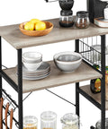Gray Sturdy Kitchen Bakers Rack with Wire Basket and Hooks, showing bowls, spices, and coffee setup on heavy duty metal frame.