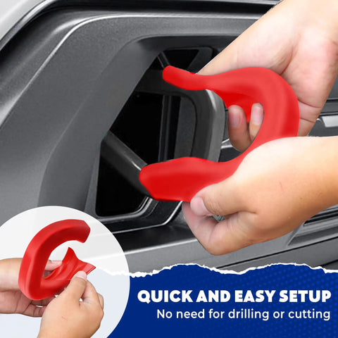 Hands installing GMC Sierra 1500 Tow Hook Cover Red Silicone Rubber Upgrade Design For 2019 To 2025 Models Front Bumper Accessory