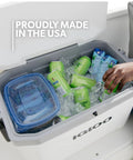 54 Qt Marine Ultra Cooler With UV Protection filled with ice and beverages, showcasing non slip handles and tight seal, white.