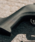 Close-up of Lightweight MOE X-22 Stock for Ruger 10/22 with TSP grip texture in black finish, showcasing control and handling.