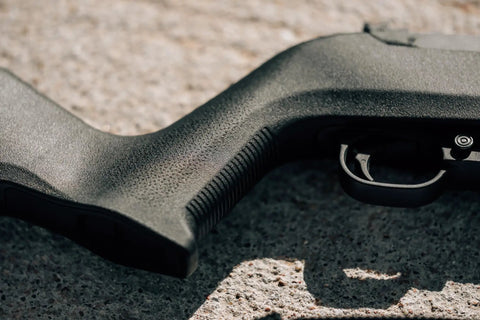 Close-up of Lightweight MOE X-22 Stock for Ruger 10/22 with TSP grip texture in black finish, showcasing control and handling.