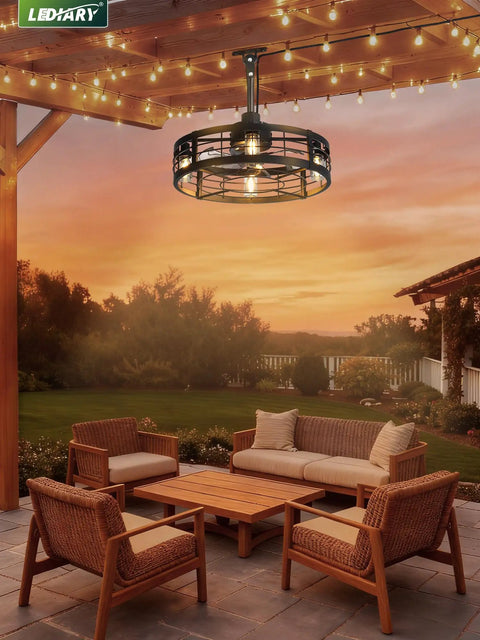 22 Inch Outdoor Ceiling Fan With Light For Patio And Pergola hanging under a pergola, caged design, sunset in the background.
