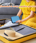 Person placing Portable Sewing Kit With Case For Home Travel And Emergency Repairs 18 Spools Thread Scissors Needles in suitcase