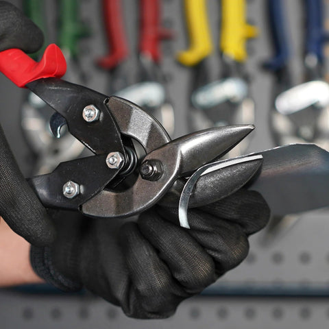 Midwest aviation snip set: two offset tin snips (left and right cut), black steel blades held by gloved hands.