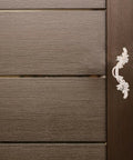 Close-up of European Style Vintage Cabinet Pull Handles Set, Ivory White Zinc Alloy on wardrobe door, retro hardware