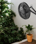 12-Inch Industrial Wall and Floor Fan With Wireless 10-Speed Controller, EC Motor, mounted on wall near plants