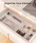 Clear Drawer Organizers Set Five Sizes Straight Up Tames Messy Vanities with kitchen utensils neatly sorted.