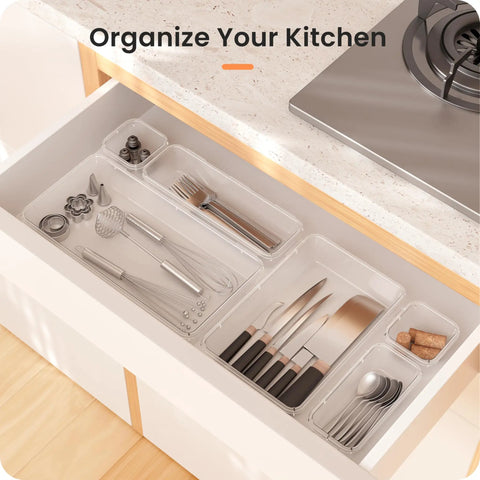 Clear Drawer Organizers Set Five Sizes Straight Up Tames Messy Vanities with kitchen utensils neatly sorted.