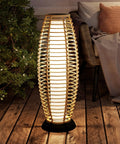 Patio Floor Lamp Outdoor Solar Powered Lantern With Weather Resistant Wicker Finish For Garden Deck And Backyard Auto On At Dusk 40 Lumens Cozy Vibe Large Sized For Indoor Outdoor Lighting Natural Brown on wooden patio with cozy chair