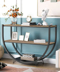 Built Different Industrial Half Circle Console Table For Entryway with brown rustic wood, two tiers, against a blue wall.