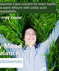 Person lying on grass near bottle of Bioavailable Lithium Orotate 20 Mg For Mood Boost And Emotional Wellness, 100 caps